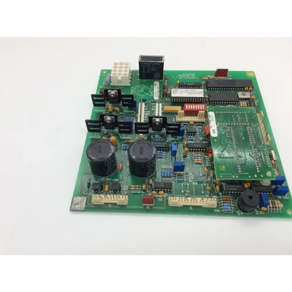 Green pcb board with black capacitors and integrated circuits datex ohmeda artwk rev 2 electronic components