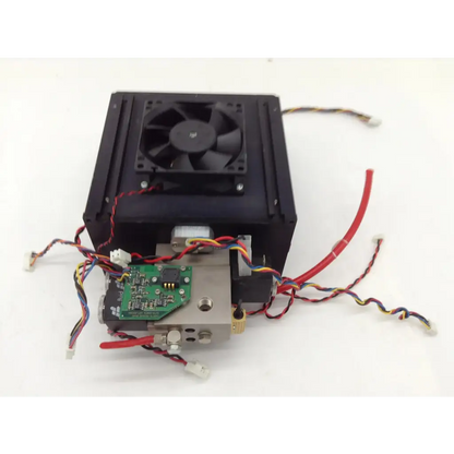 Black rectangular anesthesia machine part with integrated fan metallic components green circuit board and multicolored wiring