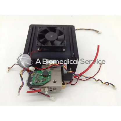 Black rectangular cooling unit with fan and circuit board in metallic housing with wires for datex-ohmeda anesthesia machine parts
