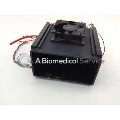 Black rectangular datex-ohmeda adu s 5 anesthesia machine part with fan and cables visible on back side