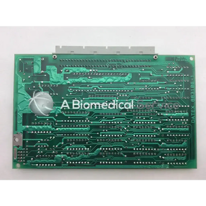 Green rectangular printed circuit board datex ul 4f 883106-1 with silver solder points and gray connector featuring m74hcu04bi