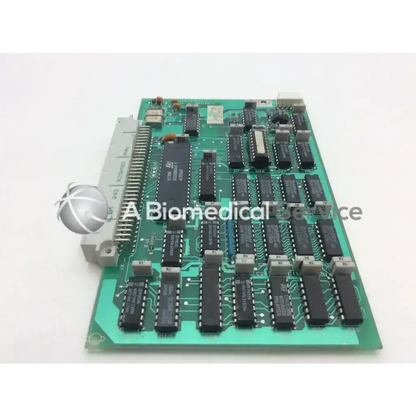 Green printed circuit board m74hcu04bi with black integrated circuits and gray connector for datex ul 4f 883106-1 control board
