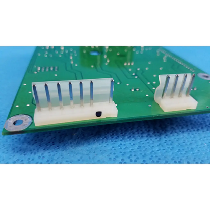 Green main power circuit board with two white plastic connectors and metallic pins for topcon retinal camera