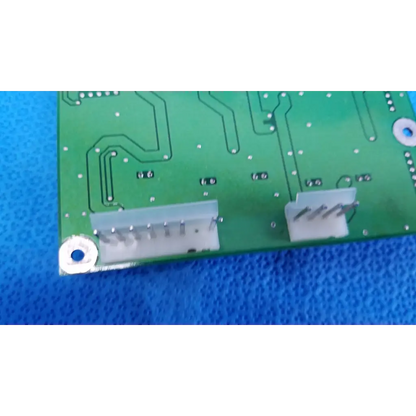 Green main power circuit board with white connectors and silver solder points for topcon retinal camera