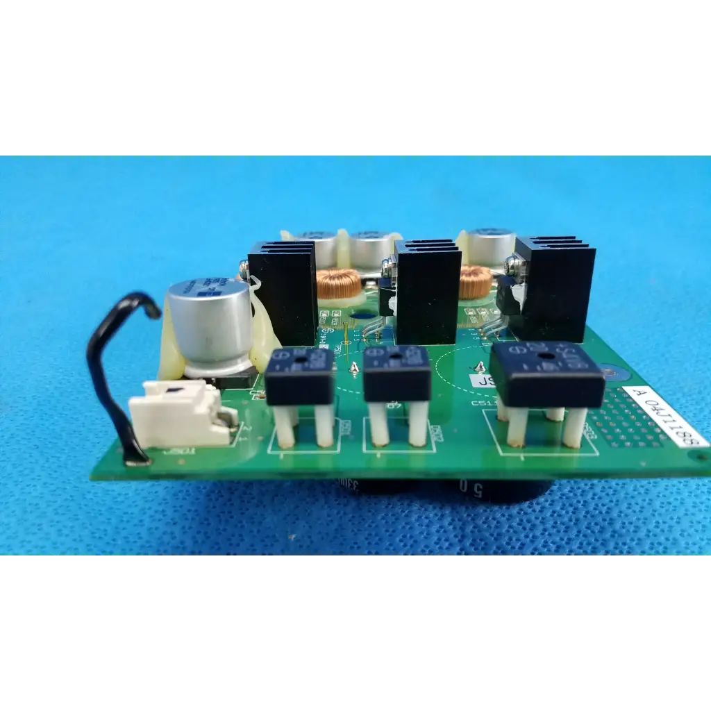 Green main power circuit board with black and silver electronic components for topcon trc-nw6sf retinal camera