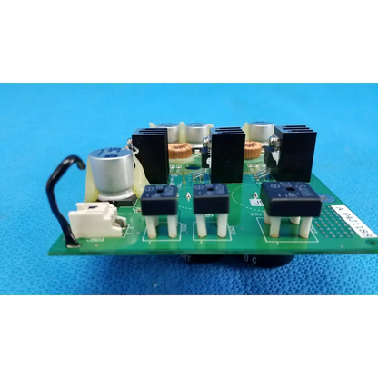 Green main power circuit board with black and silver electronic components for topcon trc-nw6sf retinal camera