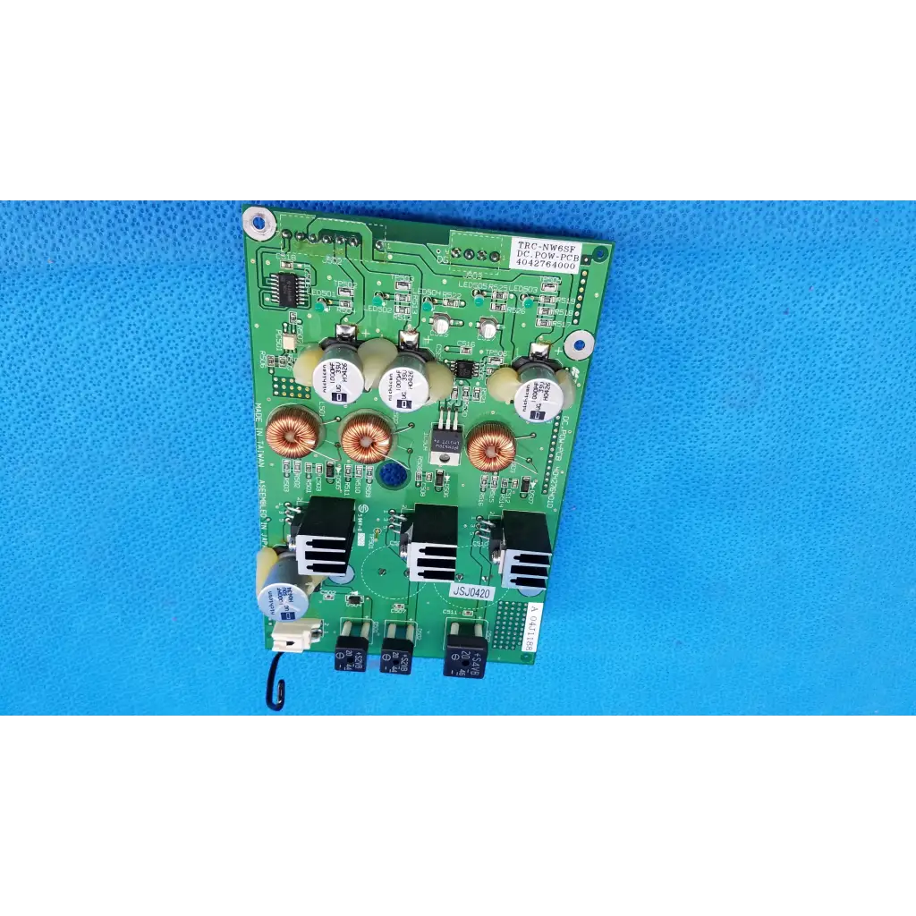 Green main power circuit board with copper coils white capacitors and black heat sinks for Topcon retinal camera