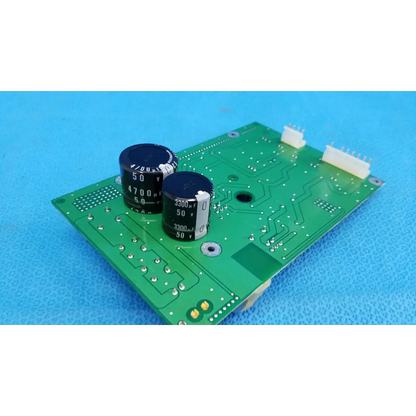 Green main power circuit board with black capacitors and white connectors for topcon trc-nw6sf retinal camera