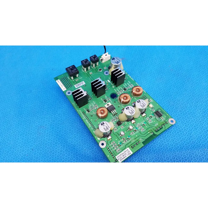 Green main power circuit board with black copper components white capacitors and heat sinks for Topcon retinal camera