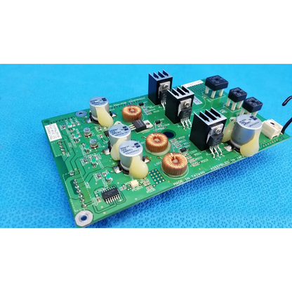 Green main power circuit board with black silver components copper coils capacitors and heat sinks for topcon retinal camera