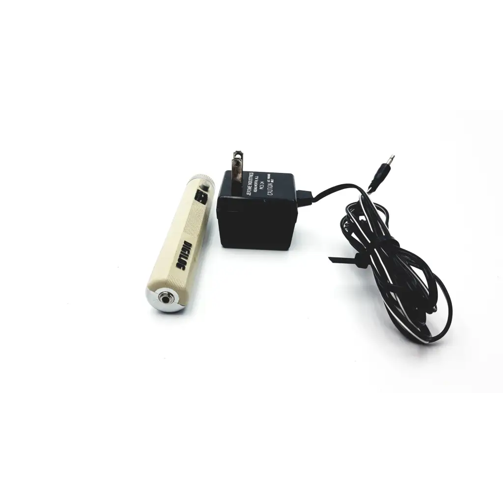 Cream-colored stihl rechargeable flashlight with metallic tip and textured grip in demetron digilog electronic pulp tester