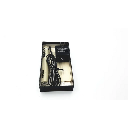 Cream-colored jepson industries model 12 electric hair clipper in original box with power adapter shown with demetron digilog electronic pulp tester