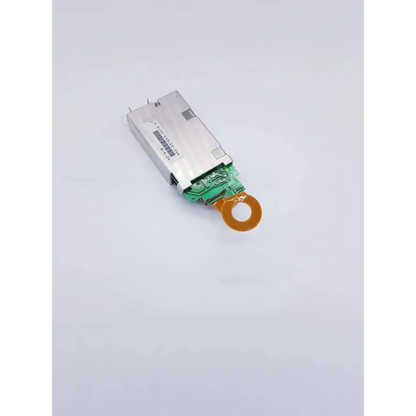 Silver rectangular densei-lambda alpha 600 power module with green circuit board and orange connector for nibp assembly board