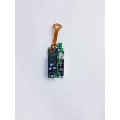 Green circuit board with orange flexible ribbon cable and components in densei-lambda alpha 600 power module for nibp assembly board