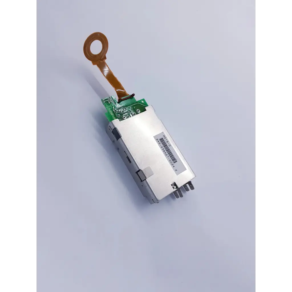 Silver rectangular densei-lambda alpha 600 power module with green circuit board and orange ribbon cable for nibp assembly board
