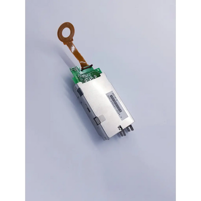 Silver rectangular densei-lambda alpha 600 power module with green circuit board and orange ribbon cable for nibp assembly board