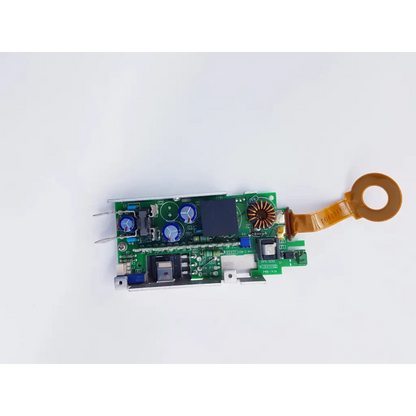 Green circuit board of densei-lambda alpha 600 power module with blue capacitors and orange ribbon cable for nibp assembly board