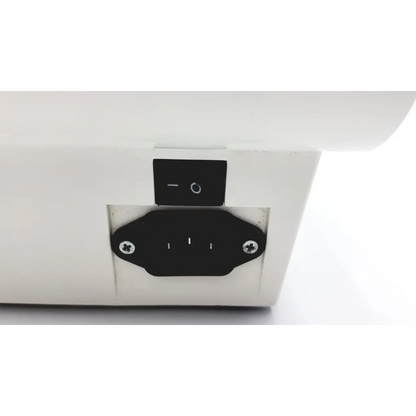 White electrical outlet with black power switch and grounding plug on the back of the densplay promix amalgamator 400