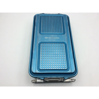 Blue perforated metal sterilization container with depuy synthes branding and five-level solid base 28639