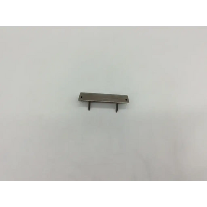 Silver metal drawer pull with two pins and flat rectangular plate for depuy 96-6275 femoral component trials