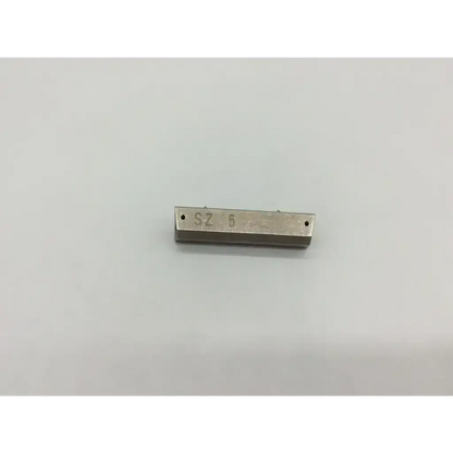 Silver metallic rectangular femoral component trial bar with sz 5 engraving and two holes for precise component trials
