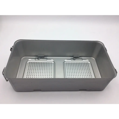 Gray metal DePuy Synthes sterilization container two level solid base with two perforated compartments and handles