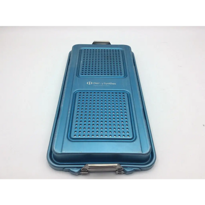 Blue metallic DePuy Synthes sterilization container two level solid base with perforated sections and silver handle