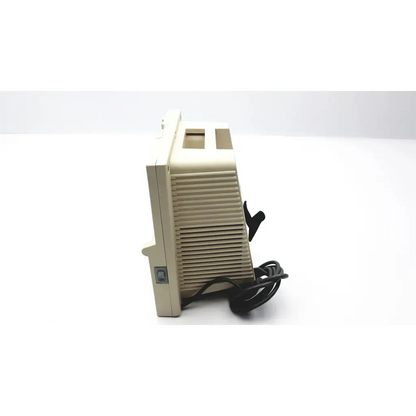 Beige plastic vintage devilbiss pulmoaide compressor monitor with vertical slatted vents and black power cord visible