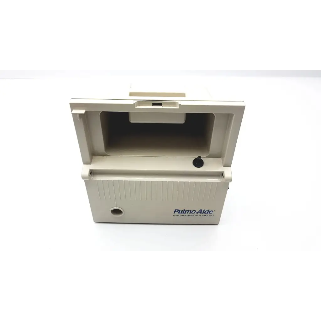 Beige plastic devilbiss pulmoaide compressor portable inhaler device with hinged lid and vertical ribbed texture