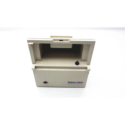 Beige plastic devilbiss pulmoaide compressor portable inhaler device with hinged lid and vertical ribbed texture