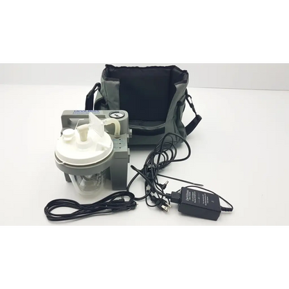 DeVilbiss suction machine 7305p-d gray and white with clear chamber black power adapter and carrying bag for homecare