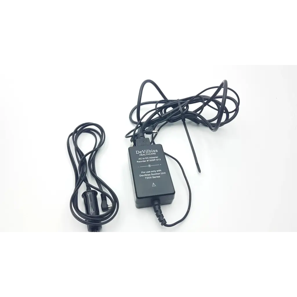 Black Devilbiss non-isolated ac to dc adapter with coiled cords for DeVilbiss suction machine 7305p-d homecare unit
