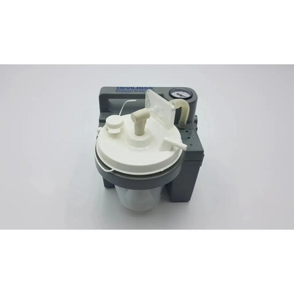 Gray and white deviilbiss suction machine 7305p-d with clear collection chamber pressure gauge and plastic components