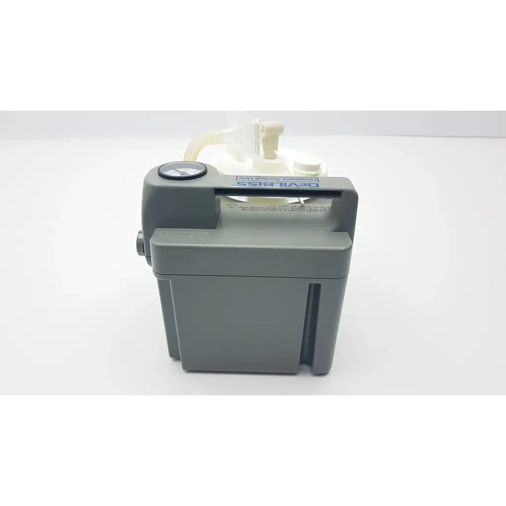 Gray plastic DeVilbiss suction machine 7305p-d with white translucent fluid reservoir and black gauge for homecare use