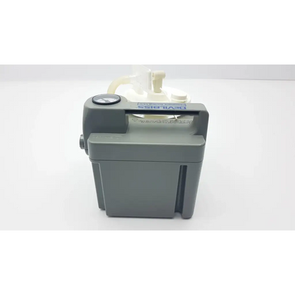 Gray plastic DeVilbiss suction machine 7305p-d with white translucent fluid reservoir and black gauge for homecare use