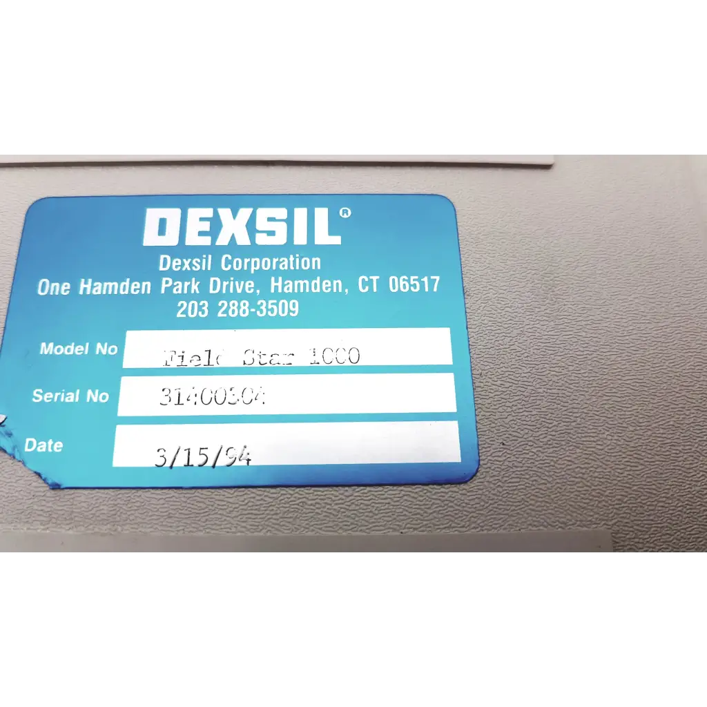 Blue rectangular label with white text showing manufacturer info on the back of a dexsil field star 1000 case