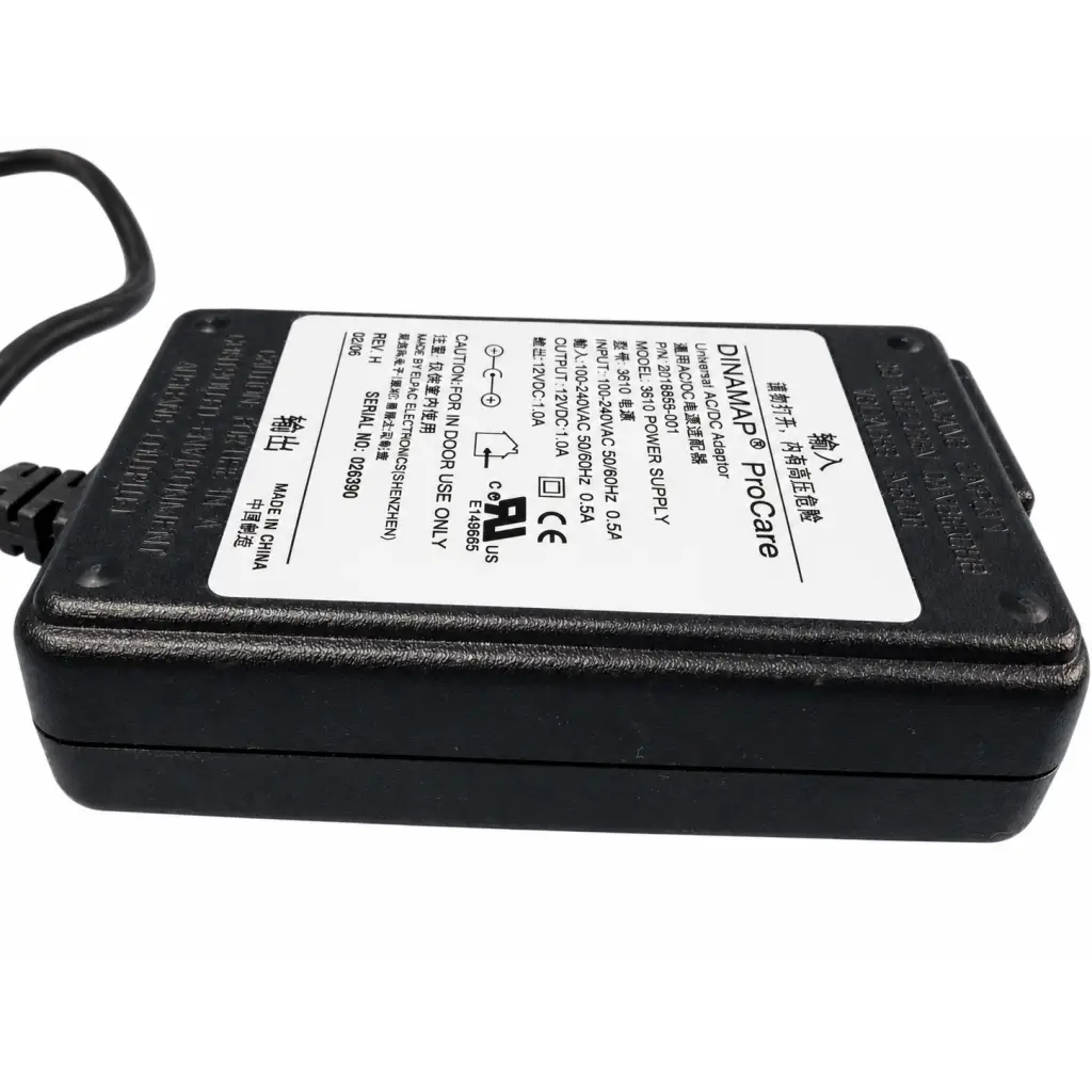 Black plastic dinamap procare 3610 power supply adapter with white label showing specifications and certification marks