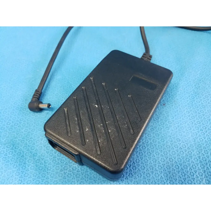 Black plastic power supply with textured surface and angled cable connector for dinamap procare 3610 adapter
