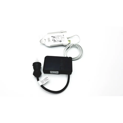 Black rectangular power adapter with coiled cable and black connector for drager ms29558 patient telemetry bedside charge meso1004a1918