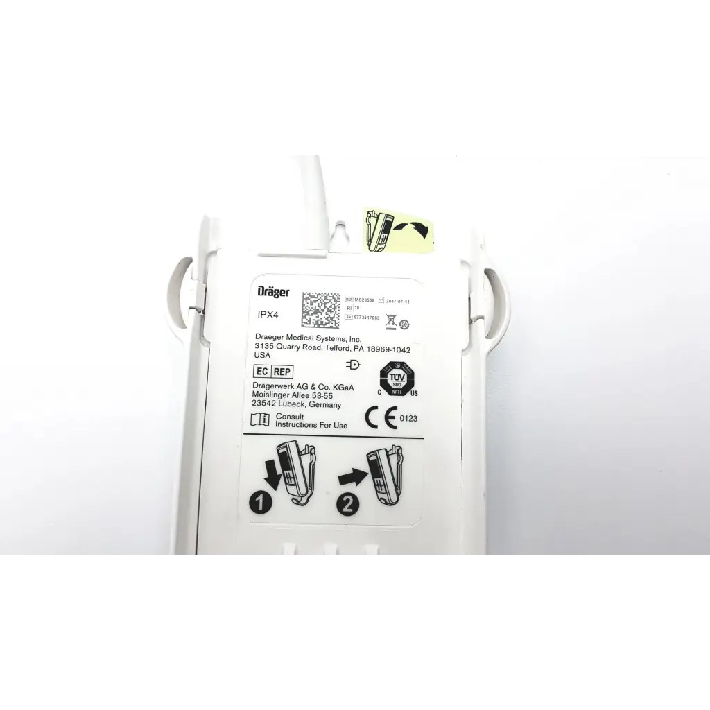 White plastic drager ms29558 patient telemetry device with molded handles and bedside charge meso1004a1918 label