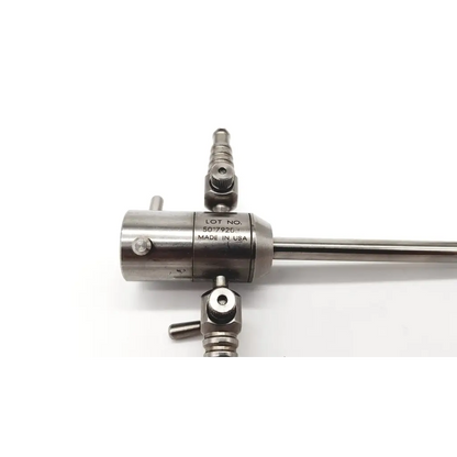 Stainless steel dual port arthroscopy sheath with cylindrical body and threaded joints engraved with lot number 5017926 made in usa