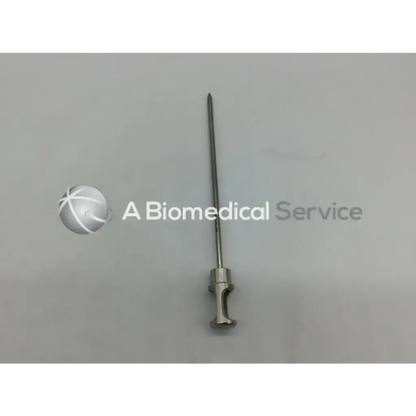 Dyonics 4356 conical tip obturator surgical needle with sleek metallic shaft and textured handle