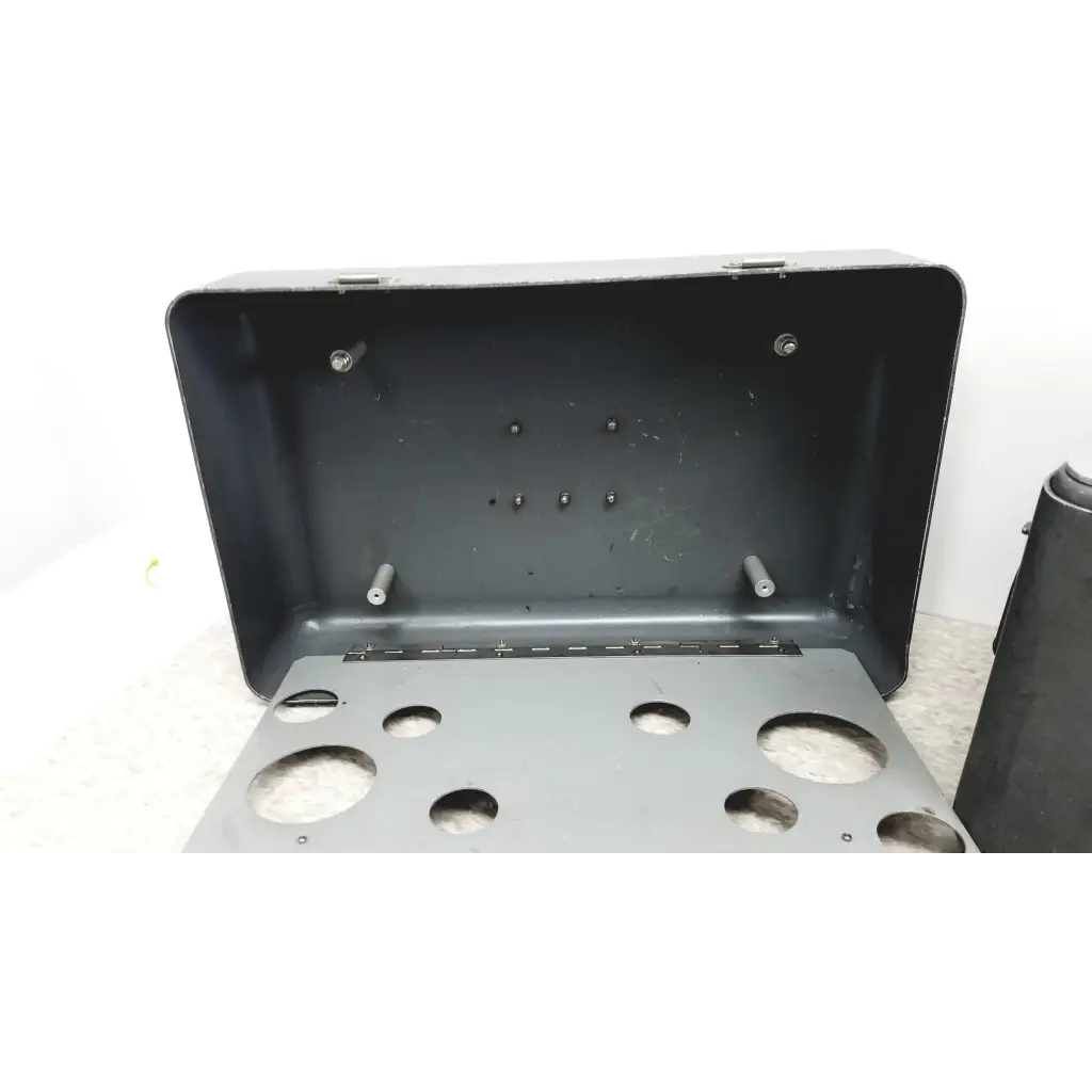 Black metal tool storage box with circular cutouts and mounting screws for Eaton UPC5000 pressure calibration standard case