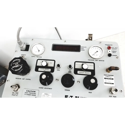 Silver metallic Eaton UPC5000 consolidated controls pressure calibration standard panel with black knobs gauges and labeled switches