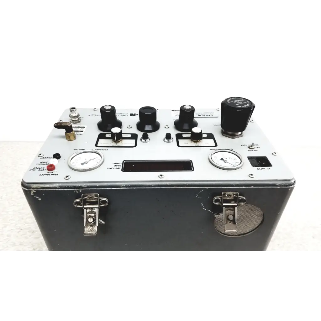 Black metal Eaton UPC5000 pressure calibration standard with silver control panel, multiple knobs, and digital display