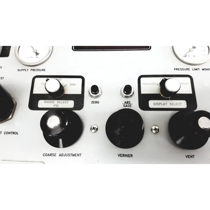 White industrial pressure control panel with black knobs and silver accents for Eaton UPC5000 pressure calibration standard