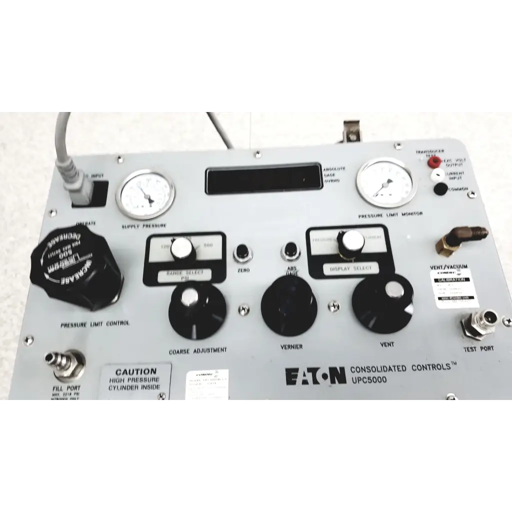 Gray metal eaton upc5000 consolidated controls pressure calibration standard panel with black knobs and labeled switches