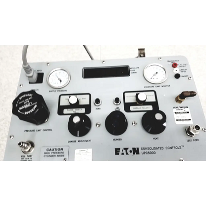 Gray metal eaton upc5000 consolidated controls pressure calibration standard panel with black knobs and labeled switches