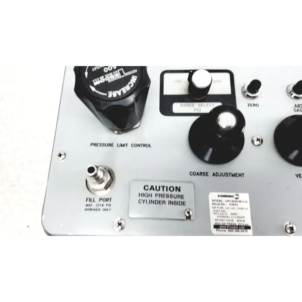 Silver Eaton UPC5000 consolidated controls pressure calibration standard with black knobs and labeled dials for pressure adjustment