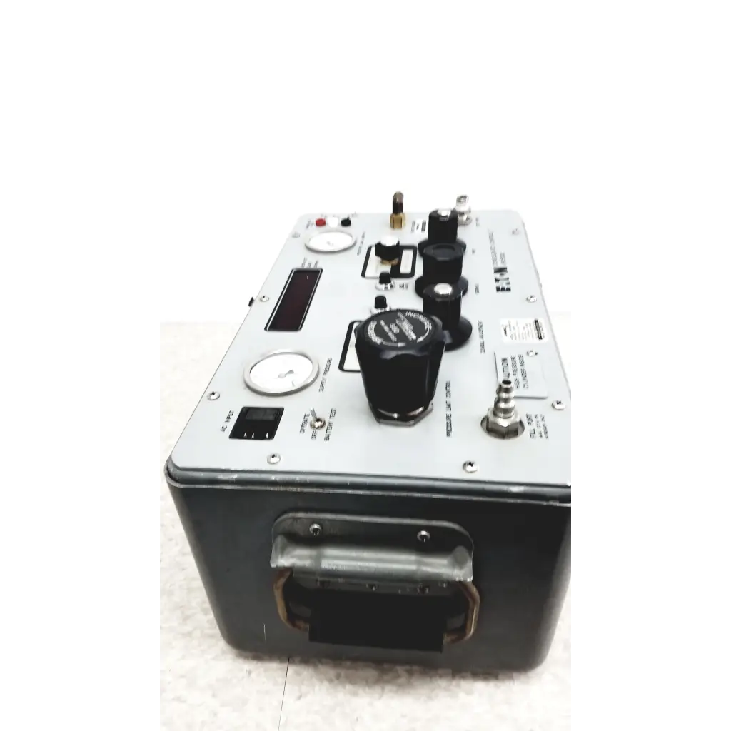 Silver and black Eaton UPC5000 consolidated controls pressure calibration standard with multiple knobs and gauges